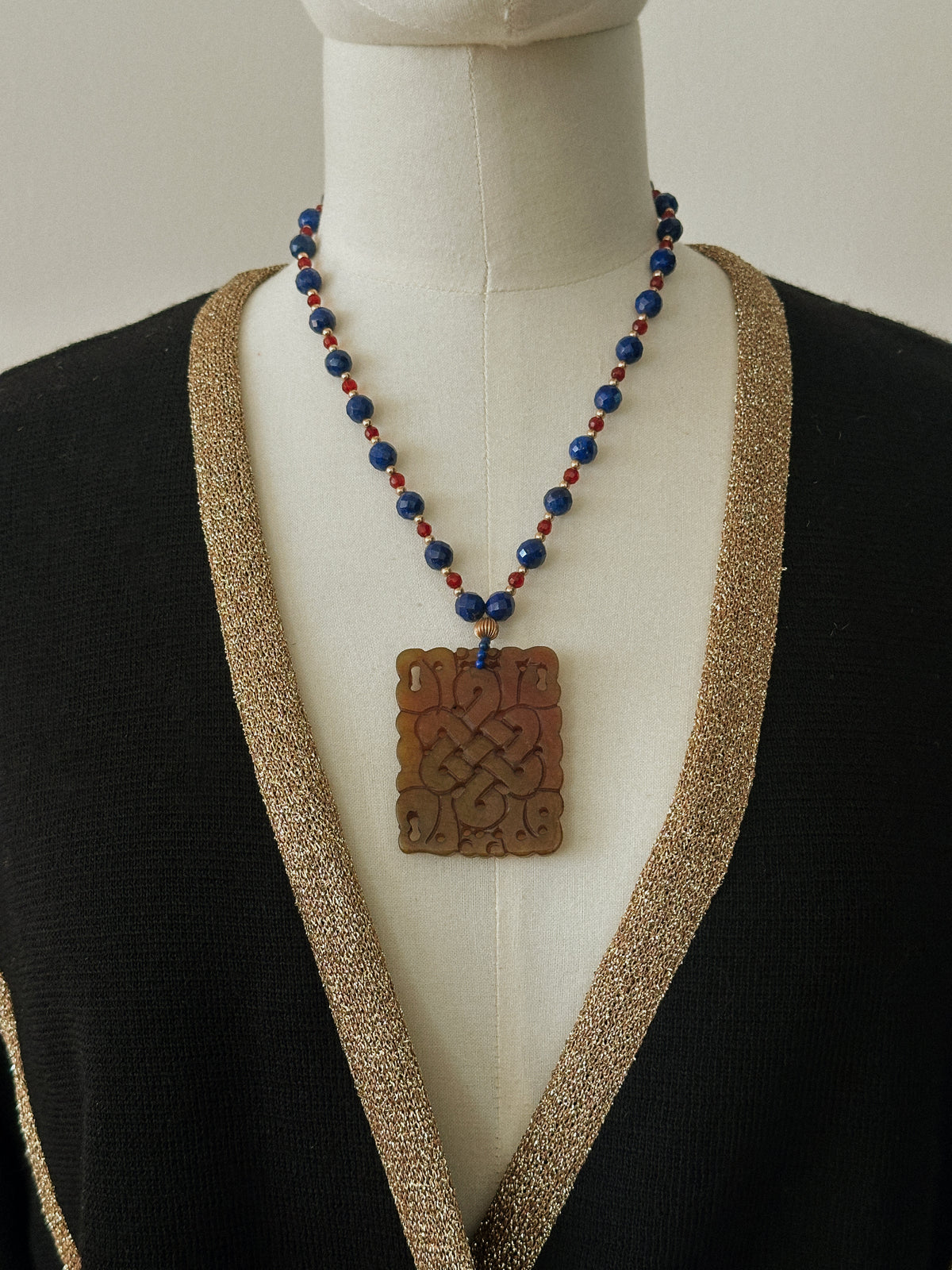 Faceted Gemstone Necklace with Carved Hardstone Pendant