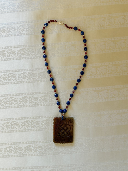 Faceted Gemstone Necklace with Carved Hardstone Pendant