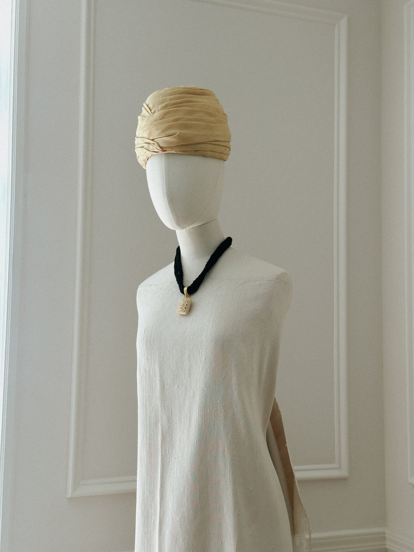 Black Rope Necklace with Carved Ivory Tone Pendant